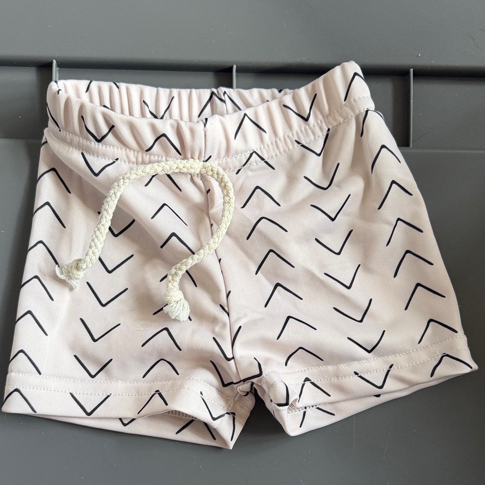 Little one shop Chevron Patterned cream swim trunks